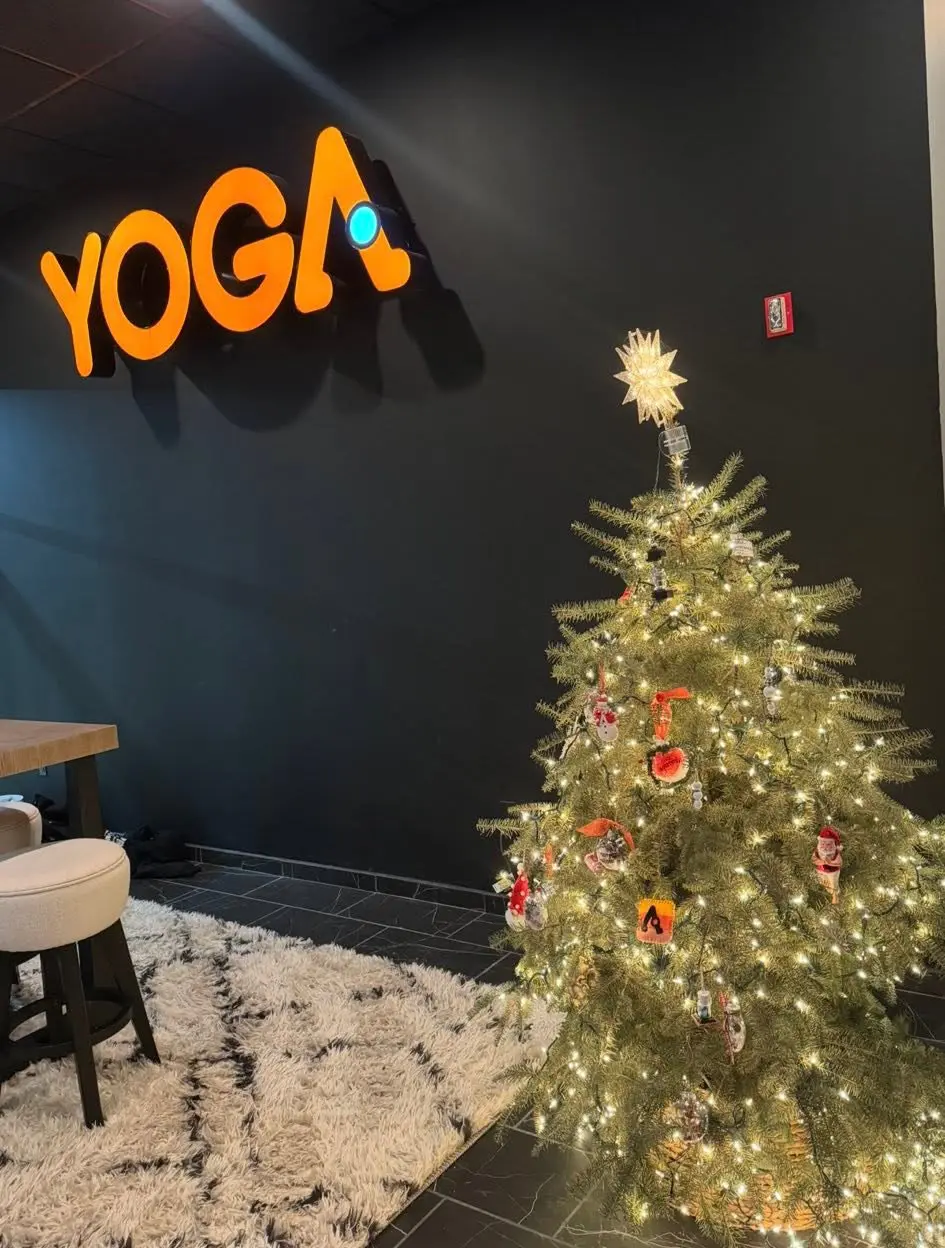 Decorated Christmas tree with warm lights in a studio lobby